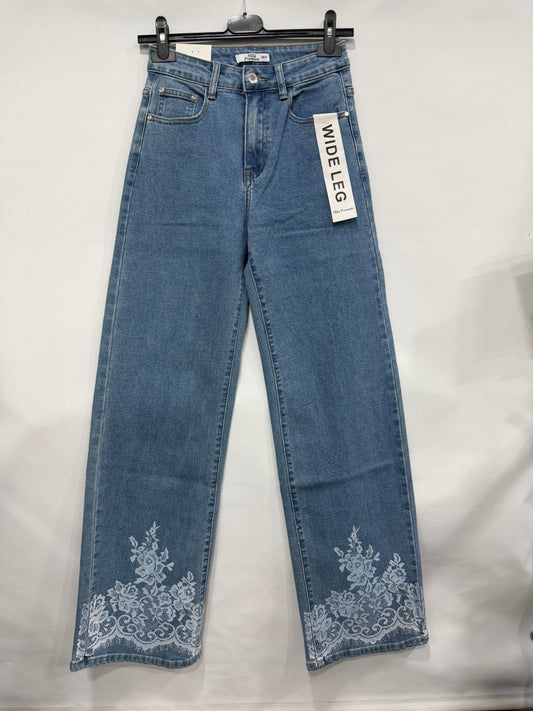JEANS A PALAZZO CON STAMPA A FIORI IN CAVIGLIA