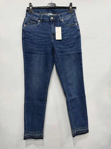 JEANS SKINNY CON BORCHIE